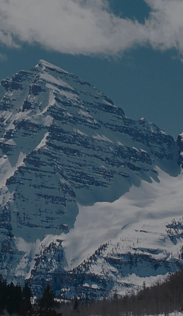 Snow-capped mountain peaks and glaciers in Aspen, Colorado - premier ski destination for luxury travel